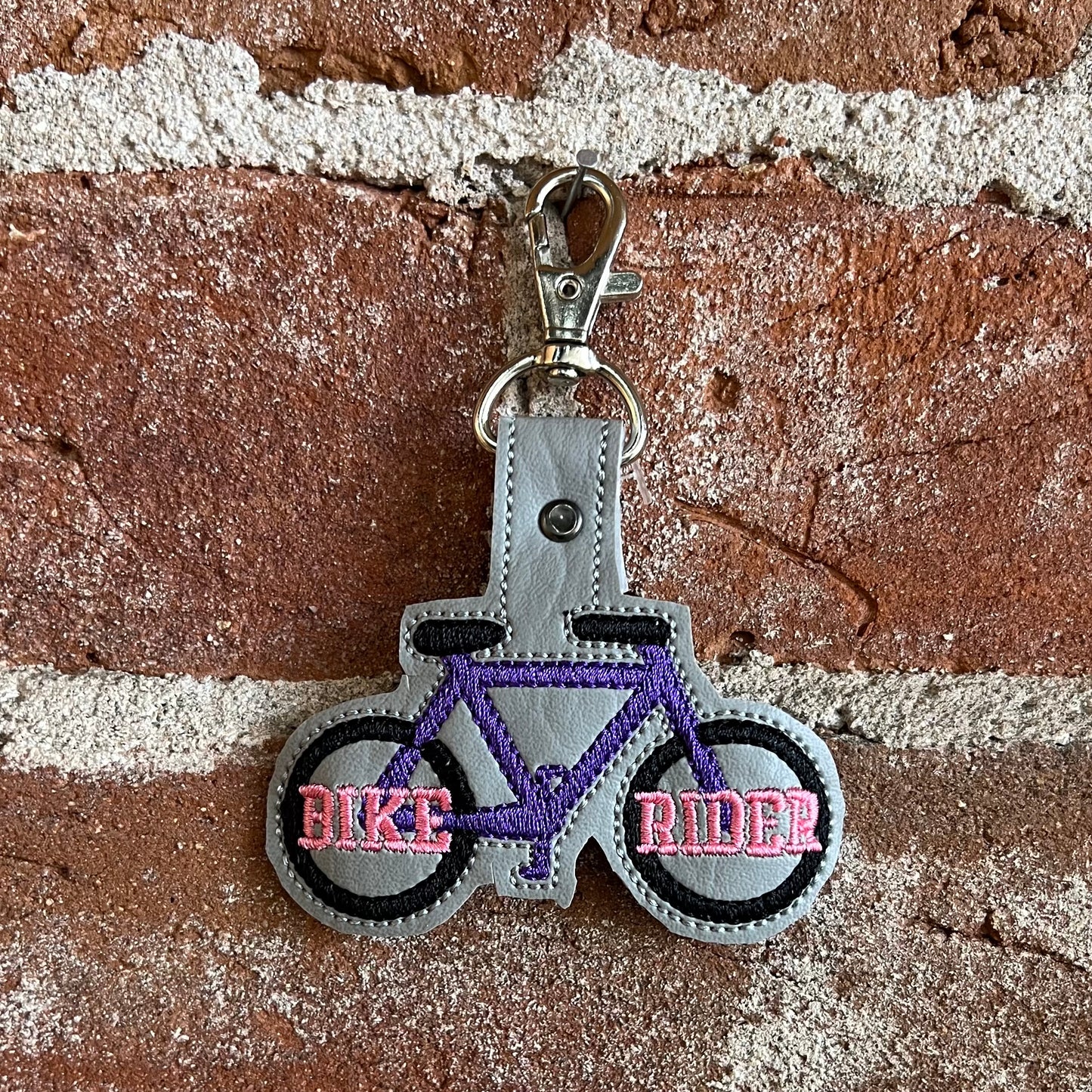 Purple Bike Rider Backpack Keychain